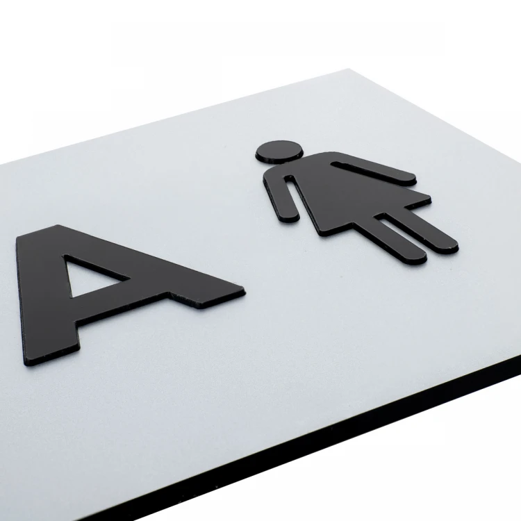 Plaque with raised letters and Braille script - Women's Toilet - silver laminate - dimensions 295x100mm - TAB504