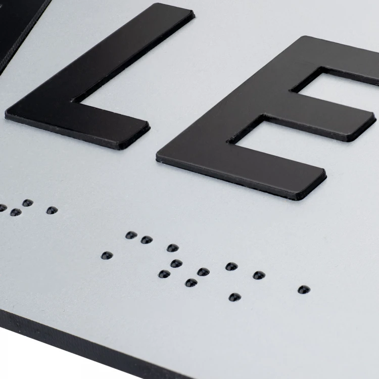 Plaque with raised letters and Braille script - Women's Toilet - silver laminate - dimensions 295x100mm - TAB504
