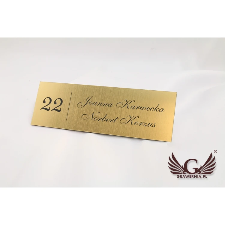 Door sign with two surnames