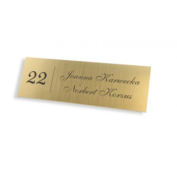 Door sign with two surnames
